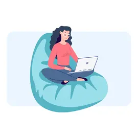 Frau mit Laptop auf einem Sitzkissen